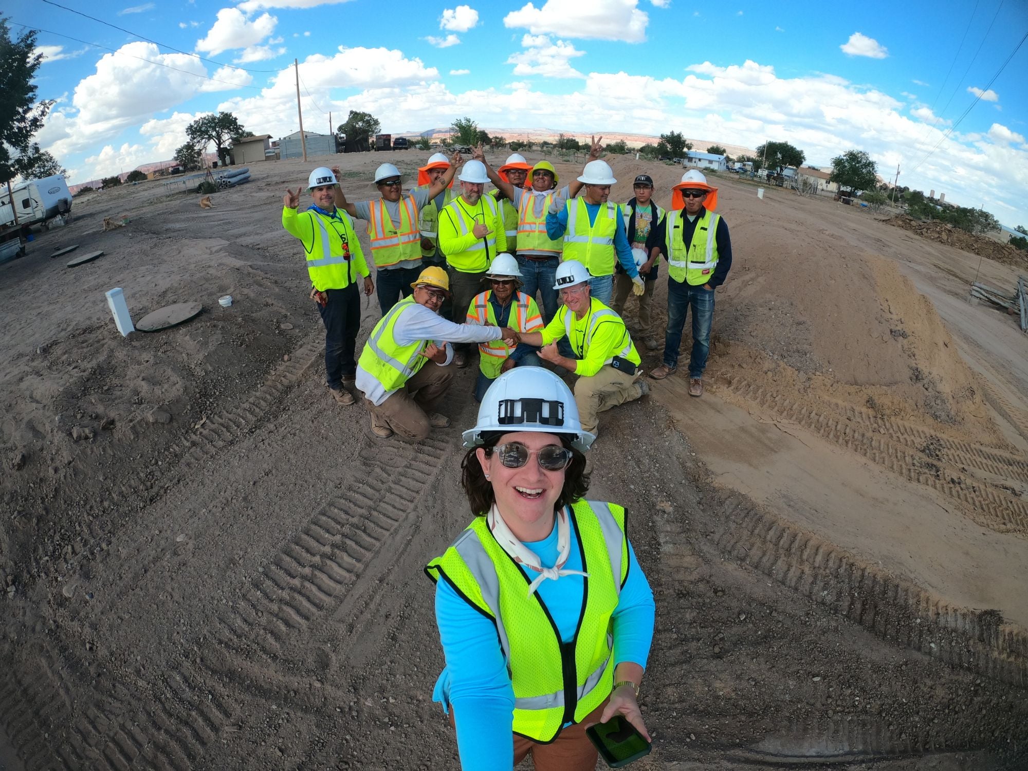 Group photo of IWSH volunteers at a job site